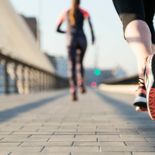 close-up-woman-running-with-unfocused-background