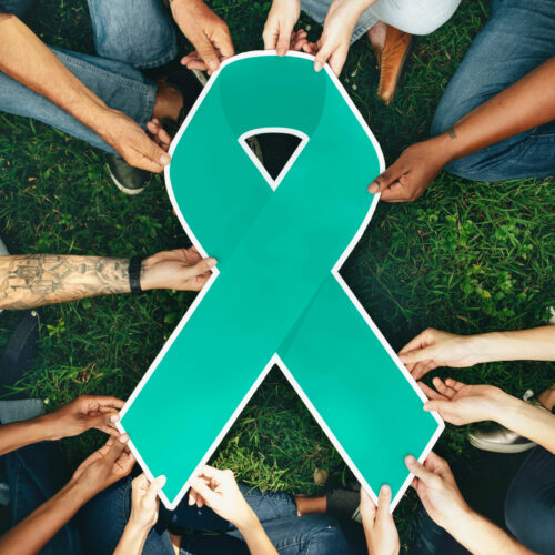 group-people-holding-green-colored-ribbon