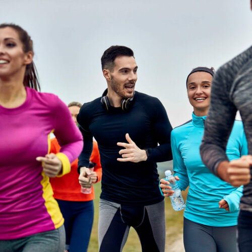 young-happy-athletic-couple-running-marathon-talking-each-other